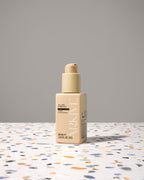Miniature bottle of Arkive's all day everyday conditioner on a table