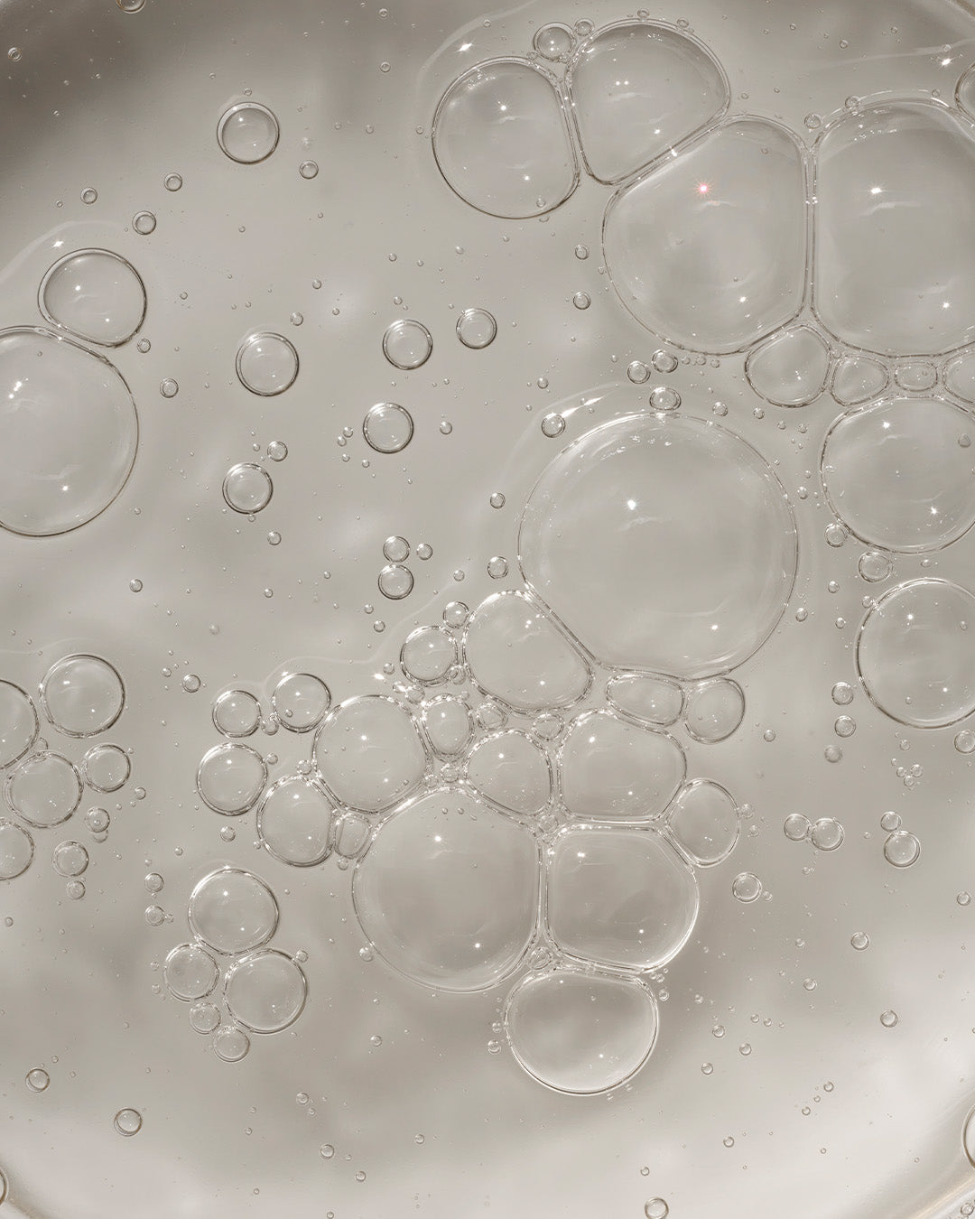 Arkive's all day extra shampoo out the bottle close up with bubbles