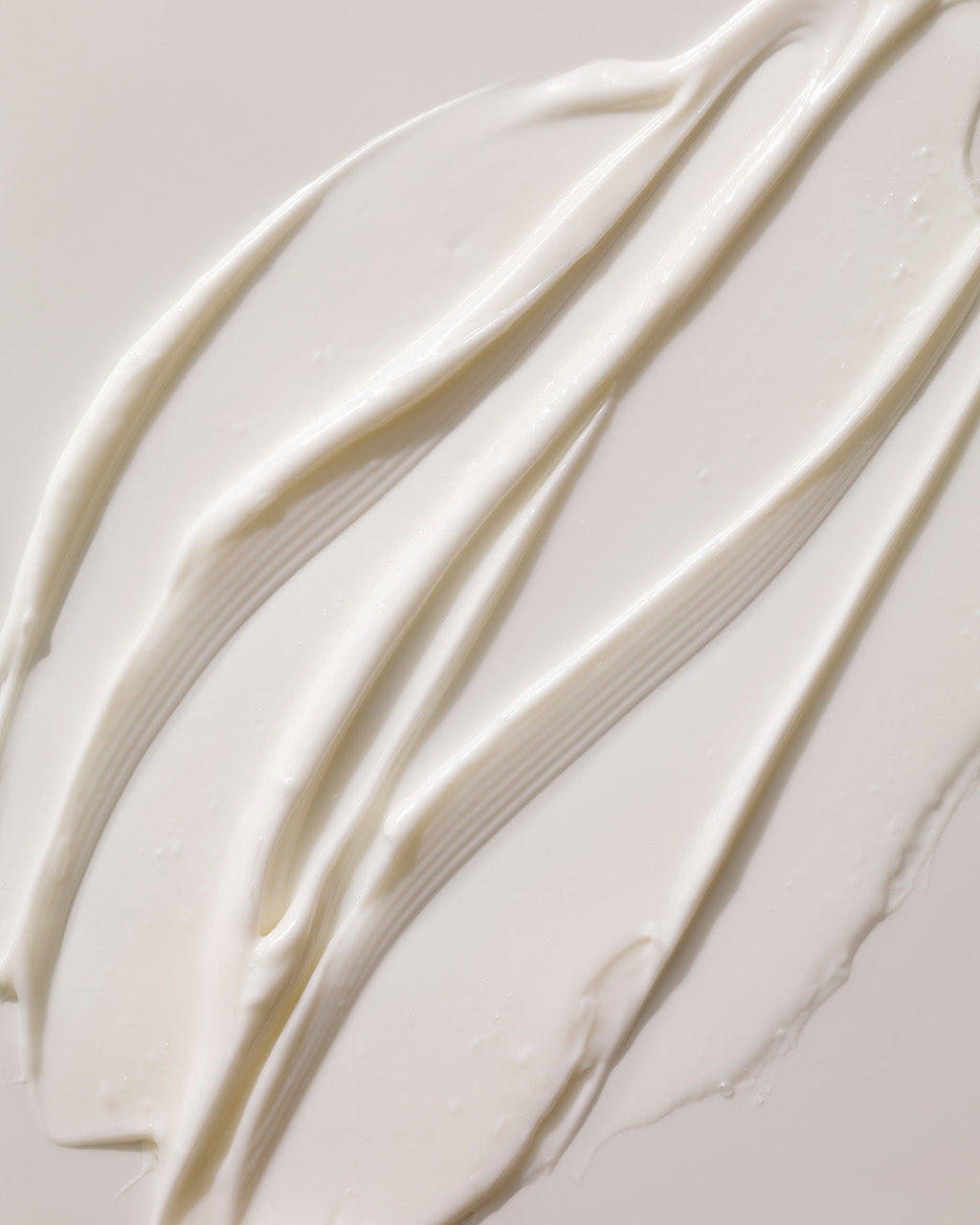 Arkive's The Future Youth hair treatment mask poured onto a white surface