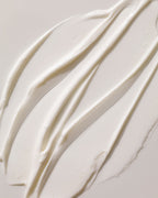 Arkive's The Future Youth hair treatment mask poured onto a white surface